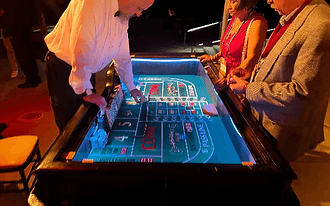 Craps dealer at a casino night party rental